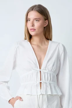 Top de manga larga de algodón con lazos