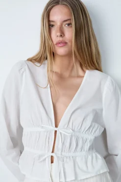 Top de manga larga de algodón con lazos